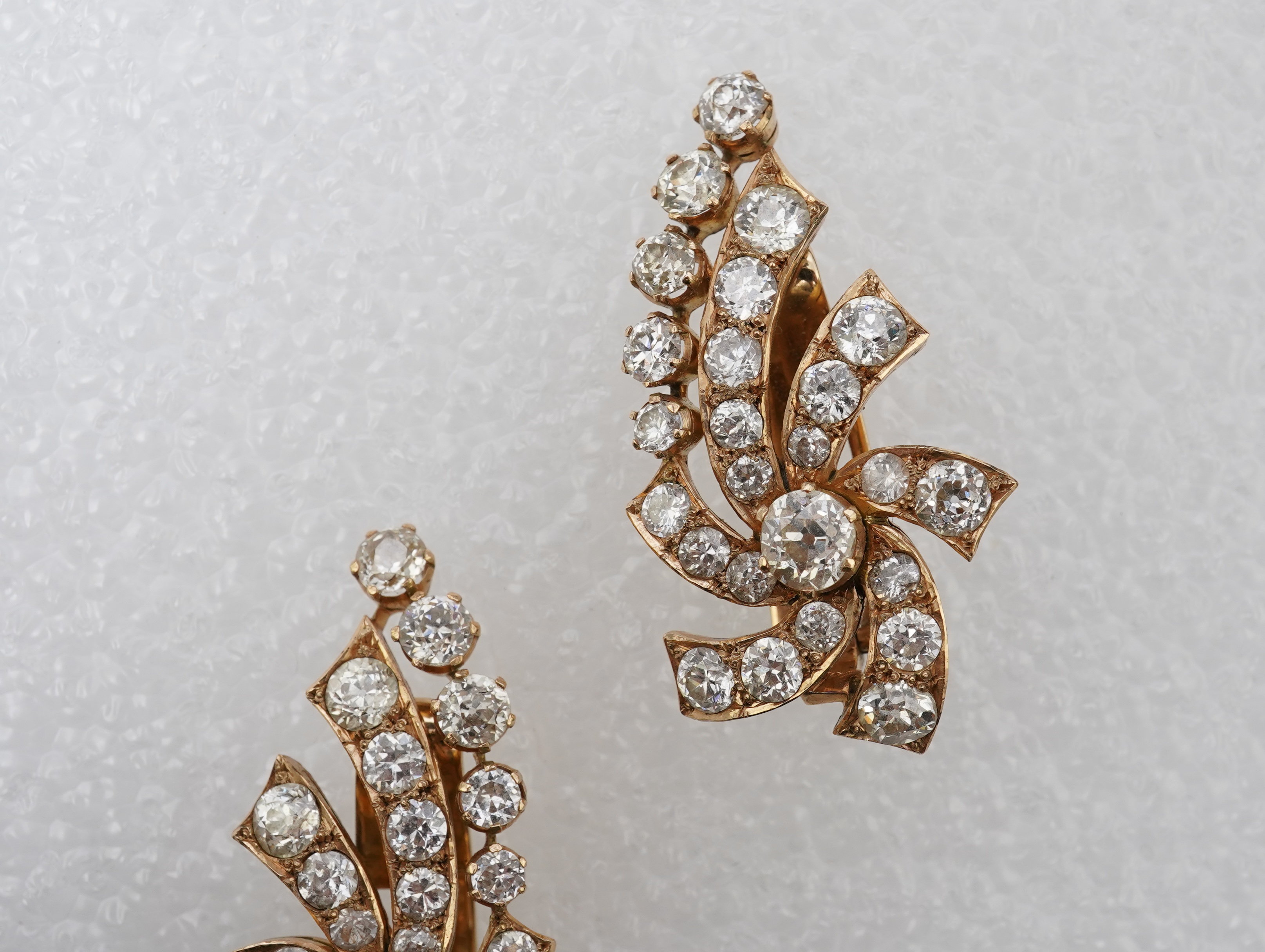 A pair of diamond ear clips, mid 20th century